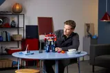 Man interacting with Optimus Prime.