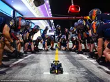 RB20 F1 car in pit lane diorama.