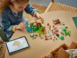 Child building LEGO Friends Panda set.