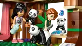 Minifigures feeding and weighing pandas.