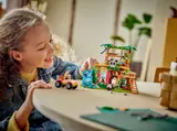 Child playing with LEGO Friends Panda set.