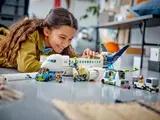 Child playing with airplane set.