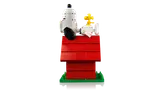 Snoopy resting on doghouse