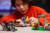 Child plays with Peely and Llama.
