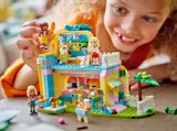Child playing with the LEGO Pet Accessories Shop on a table.