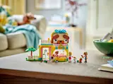 The LEGO Pet Accessories Shop displayed on a table in a home setting.