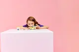 Girl looking at the LEGO Pet Van.