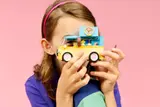 Girl holding LEGO Pet Van.