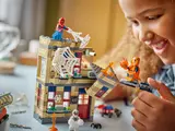Girl playing with Spider-Man and collapsing roof.