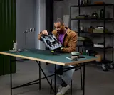 Man holding LEGO Technic PEUGEOT 9X8.