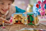 Child playing with minifigure and cake interior.