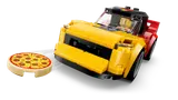 Close-up of LEGO sports car with pizza.