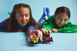 Children playing with cars.