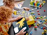 Children using Braille Bricks with a tablet app.