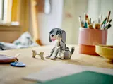 Child playing with LEGO dog.