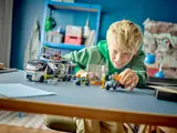 Child playing with set.