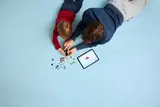 Building LEGO with digital guide.