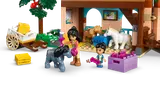 Minifigures caring for ponies in the stable.