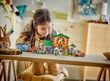 Child playing with the LEGO ranch.