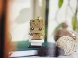 Potted Groot on a shelf in a home setting.