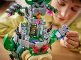 Child placing Spike figure on Bowser's Castle.