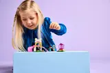 Child playing with set.