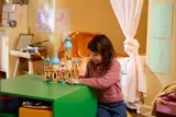 Child playing with completed castle.