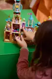 Child pointing inside castle.