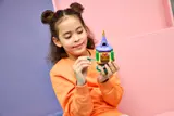 Child using key on tower.