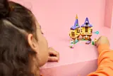 Child playing with open tower.