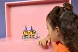 Child observing open tower.