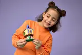 Child smiling with tower section.