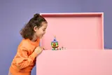 Child observing closed tower section.