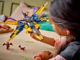Child holding Ninjago jet.