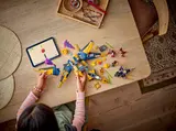 Child building Ninjago jet.