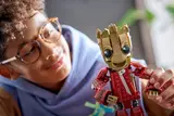 Child holding LEGO Groot close-up.