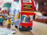 Bus driver greets tourist at museum.