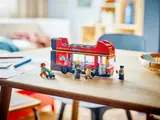 LEGO bus and minifigures on table.