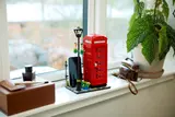 LEGO telephone box on windowsill.