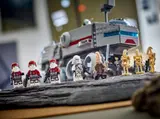 Minifigures on rocky terrain.