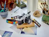 LEGO camera on desk.