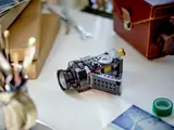 Open LEGO video camera on desk.