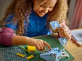 Child turning retro phone dial.