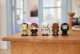 Star Wars BrickHeadz on a wooden table.