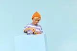 Child playing with LEGO loader.