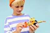Child adjusting loader bucket.