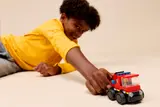 Child playing with truck.