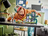 Child playing with LEGO Roller-Coaster Park.