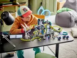 Wide shot of child playing with LEGO park.