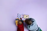 Child and adult using digital LEGO instructions.